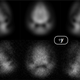 The shadow of the skyrmion, demonstrating the complex structure of the particles clumping in three different spin states. The top row shows what the team expected to see based on theory, and the bottom shows what they actually saw.